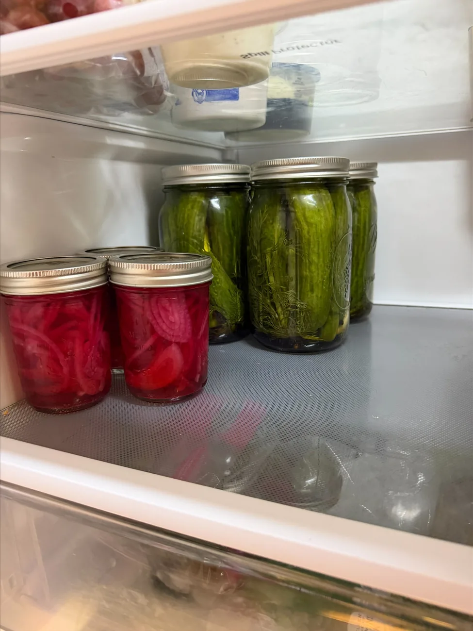 Photo of homemade bright pink pickled red onions